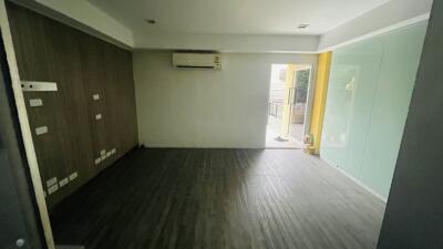 Spacious living room with air conditioning and access to balcony