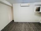 Unfurnished bedroom with air conditioning