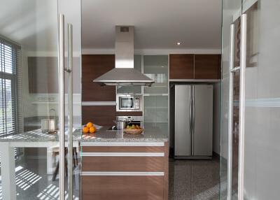 Modern kitchen with stainless steel appliances and a central island