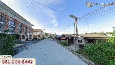 Street view of the neighborhood with buildings and houses