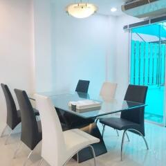 Modern dining room with glass table and chairs