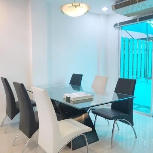 Modern dining room with glass table and chairs