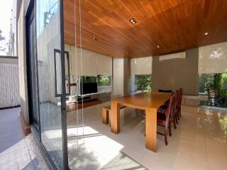 Modern dining room with wooden ceiling