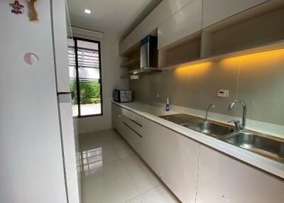 Modern kitchen with ample storage and natural light