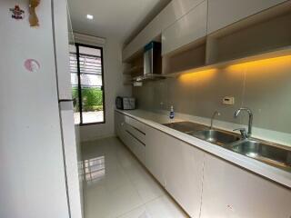 Modern kitchen with ample storage and natural light