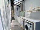 Narrow laundry area with glass roof