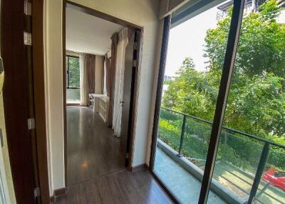 Bright living area with large windows and a view of greenery