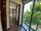 Bright living area with large windows and a view of greenery