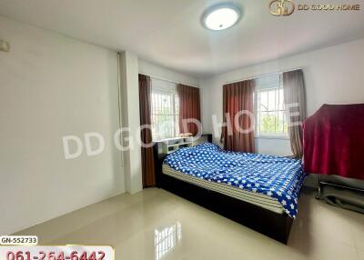 Spacious bedroom with large bed and ample natural light