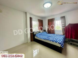 Spacious bedroom with large bed and ample natural light