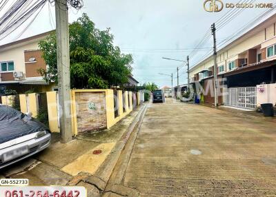 Residential neighborhood with houses and cars parked outside