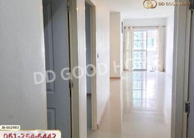 Bright hallway with doors leading to other rooms