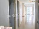 Bright hallway with doors leading to other rooms