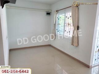 Empty room with tiled floor and window