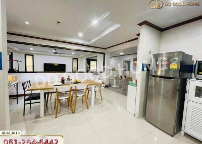 Modern kitchen and dining area with stainless steel appliances