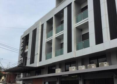 Modern multi-story residential building with balconies