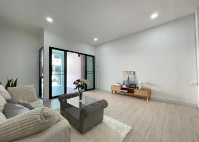 Modern living room with large windows and minimalist decor