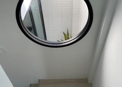 Staircase with round window