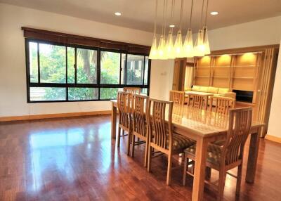 Spacious dining room with large windows and wooden floor