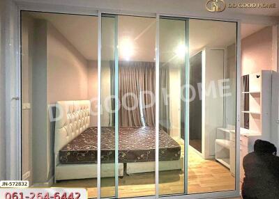 spacious bedroom with bed and glass sliding doors