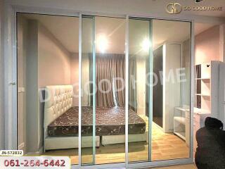 spacious bedroom with bed and glass sliding doors