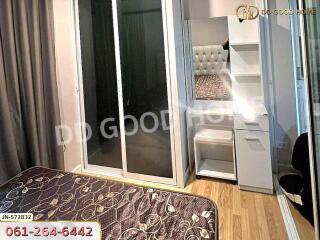 Bedroom with sliding glass doors and vanity desk