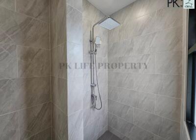 Modern shower with gray tiles