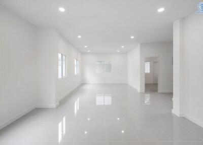 Spacious and well-lit living room with large windows