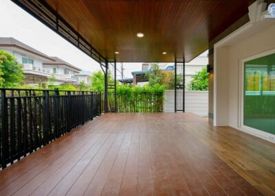 Spacious patio with wooden flooring and ceiling