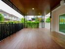 Spacious patio with wooden flooring and ceiling