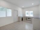 Spacious modern kitchen with large windows and sink