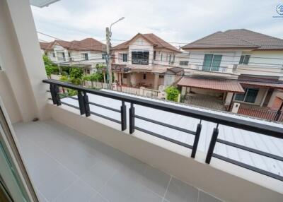 View from the balcony overlooking neighboring houses