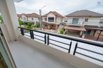 View from the balcony overlooking neighboring houses