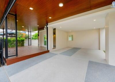 Covered outdoor area with a garage space