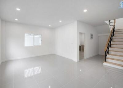 Spacious empty living room with stairs