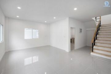 Spacious empty living room with stairs