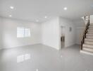 Spacious empty living room with stairs