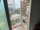 Balcony with laundry area and city view