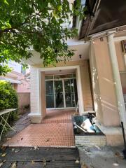 Entrance to the house with tiled flooring and glass doors