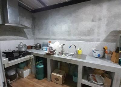 Simple kitchen setup with essential cooking appliances and utensils