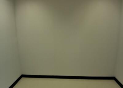 Empty room with fluorescent lighting