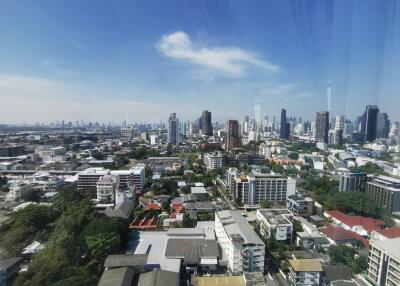 Panoramic cityscape with high-rise buildings and clear blue sky