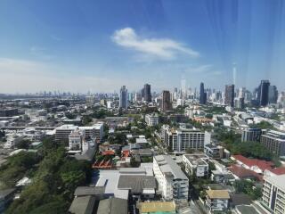 Panoramic cityscape with high-rise buildings and clear blue sky