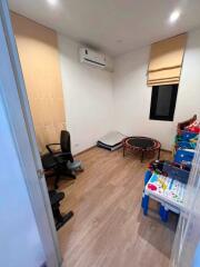 Small room with toys and office chair