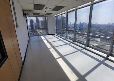 Spacious office with large windows and city view