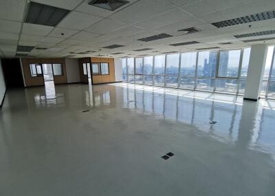 spacious office area with large windows