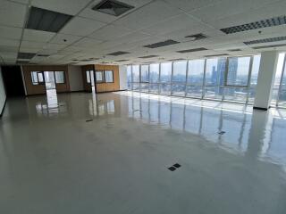 spacious office area with large windows