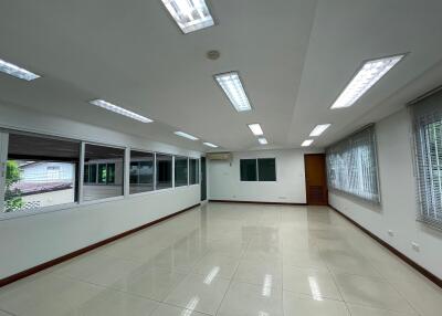 Spacious, well-lit living area with large windows