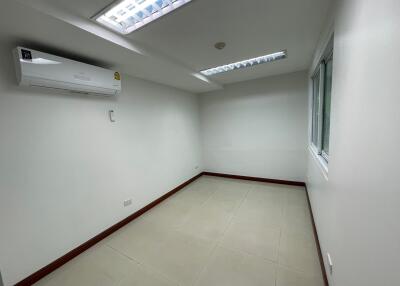 Empty room with tiled flooring and air conditioning