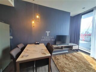 Living room with dining area and balcony view